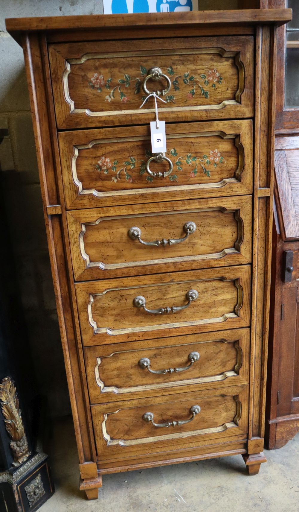 An American stencilled walnut six drawer tall chest, width 61cm, depth 46cm, height 132cm